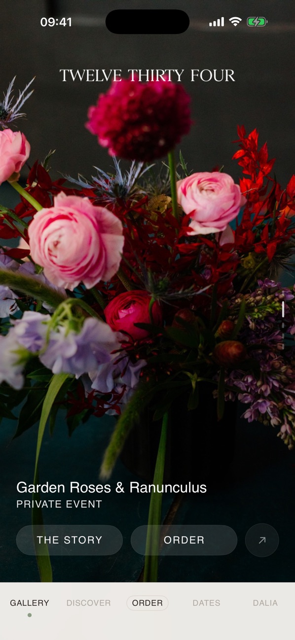 Twelve Thirty Four showing a garden roses and ranunculus arrangement.